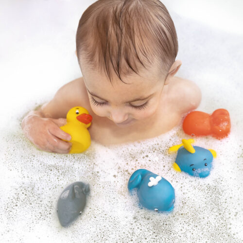 A kid playing with the Bath Buddies from Battat.